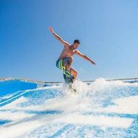 flowrider-surf-simulator-instructor-man-day-activity